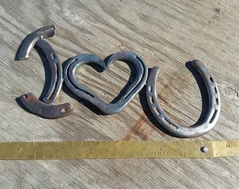 Forged I love you horseshoe sign