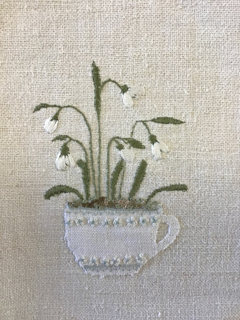 Snowdrops in a tea cup embroidery pattern