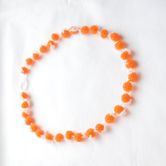 Orange beaded necklace deals
