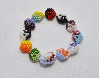 May include: A colorful beaded bracelet with a variety of colors and patterns. The bracelet is made of small, round beads that are strung together in a circular pattern. The beads are arranged in a rainbow pattern, with each bead representing a different color.