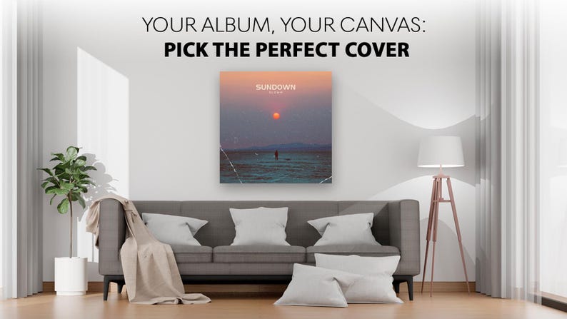 May include: A square canvas print featuring a sunset over water with the text "SUNDOWN" and "ALBUM" displayed above a lone figure. The text "YOUR ALBUM, YOUR CANVAS: PICK THE PERFECT COVER" is printed in black above the centered wall art piece.