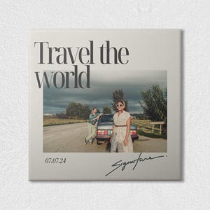 May include: A square print featuring the text Travel the world at the top, a photograph of two individuals standing by a car on a road, the date 07.07.24 in the bottom left corner, and a handwritten signature in the bottom right corner.