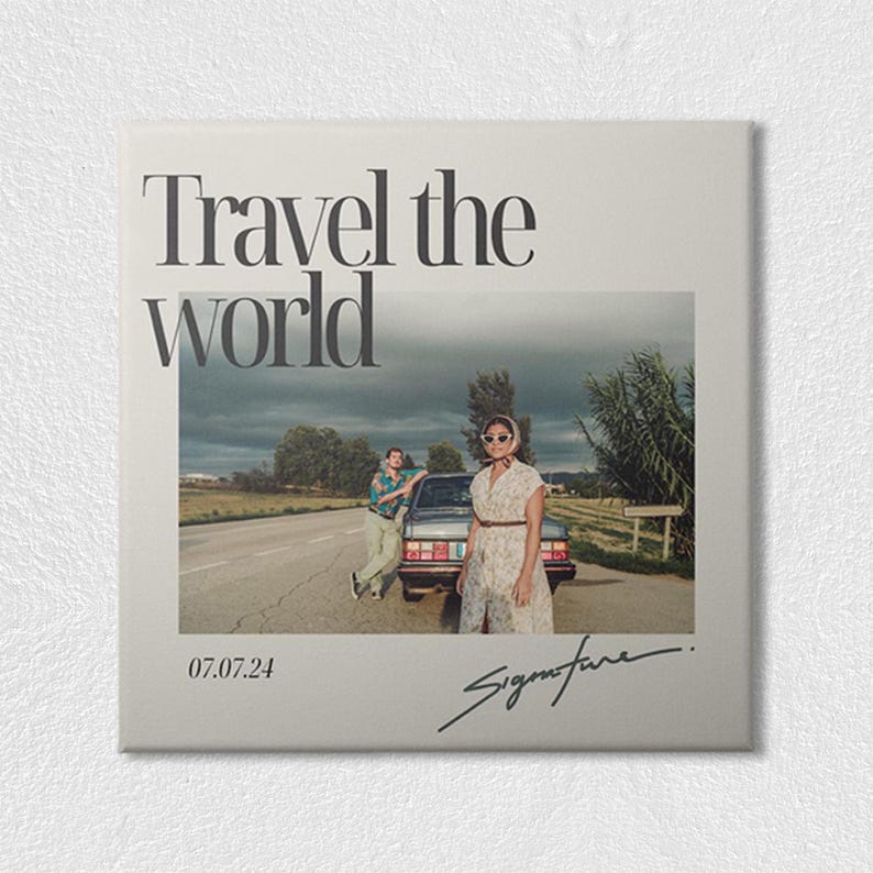 May include: A square print featuring the text Travel the world at the top, a photograph of two individuals standing by a car on a road, the date 07.07.24 in the bottom left corner, and a handwritten signature in the bottom right corner.