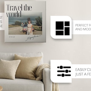 May include: A square canvas print featuring the text Travel the world at the top, a photograph of two people standing by a car on a road in the center, the date 07.07.24, and a handwritten signature at the bottom, displayed above a light gray sofa.