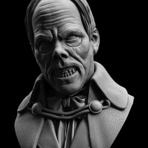 May include: A grayscale bust sculpture of a man with a stern expression. The figure has a detailed face with closed eyes, a prominent brow, and visible teeth. He wears a coat with decorative rope and button details, and a bow tie. The bust is mounted on a pedestal.