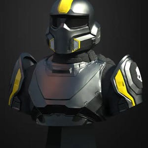 May include: A black and yellow futuristic helmet with a visor and a chest plate. The helmet has a yellow stripe across the top and yellow accents on the sides.
