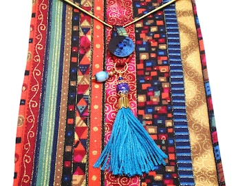 Colorful graphics stripes squiggles squares triangles handmade quilted tarot card bag handmade tassel blue gold beads green gold blue black