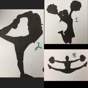 May include: Three black silhouettes of cheerleaders in different poses on a white background. Figure 1 jumps with pom-poms, figure 2 performs a scorpion stretch, and figure 3 executes a toe touch jump with pom-poms. Each figure has a green number.