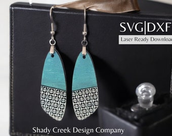 May include: A pair of teal and white wooden earrings with a geometric pattern. The earrings are on a black background with the text "SVG|DXF Laser Ready Download" and "Shady Creek Design Company".