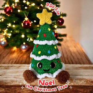 May include: A green crocheted Christmas tree with a yellow star on top. The tree has colorful ornaments and a smiling face. The text "Noel the Christmas Tree" is at the bottom. The PDF file is available.
