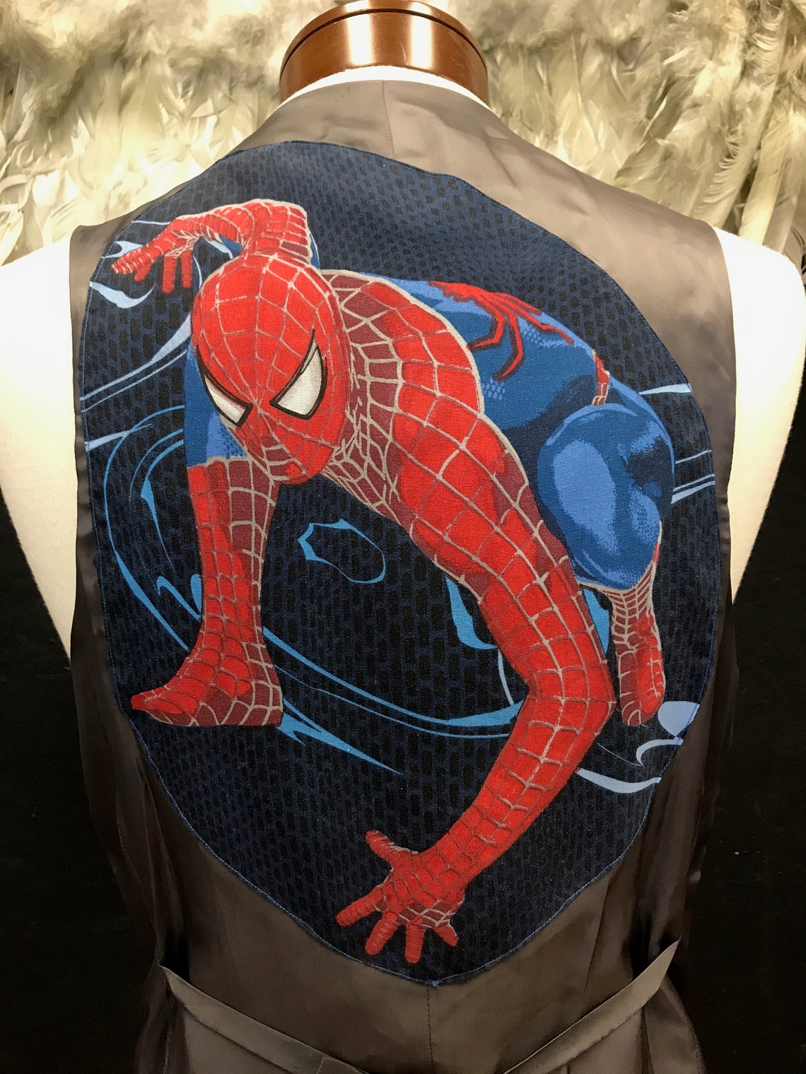 spiderman with blue vest