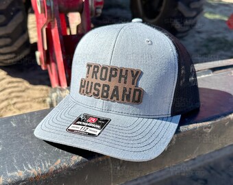 Trophy Husband leather patch hat - funny and cool cap! Hats make a great gift! Comes with a FREE matching sticker!