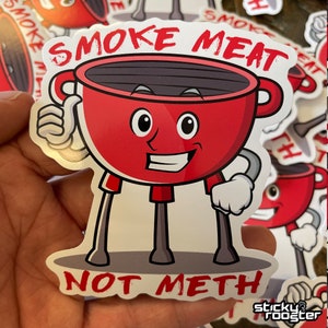 Smoke Meat Not Meth sticker with a little grill giving a thumbs up.