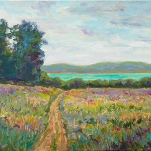 May include: A painting of a dirt road leading through a field of purple wildflowers towards a lake and hills in the distance. The sky is a light blue with white clouds.