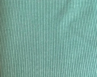 Green stripe upholstery fabric.  Sold by the yard
