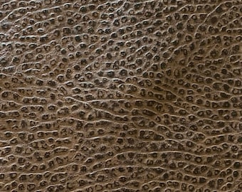 Vestige.  Tissu cuir gaufré noir et marron.