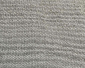 Heavy (12 oz) cotton cream color weave.  Sold by the half yard.