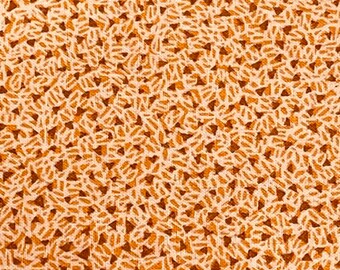 Géométrie orange.  Vendu par demi-mètre.