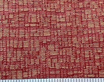 Reddish orange upholstery fabric.  Sold by the yard.