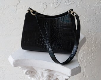 white and black snakeskin purse
