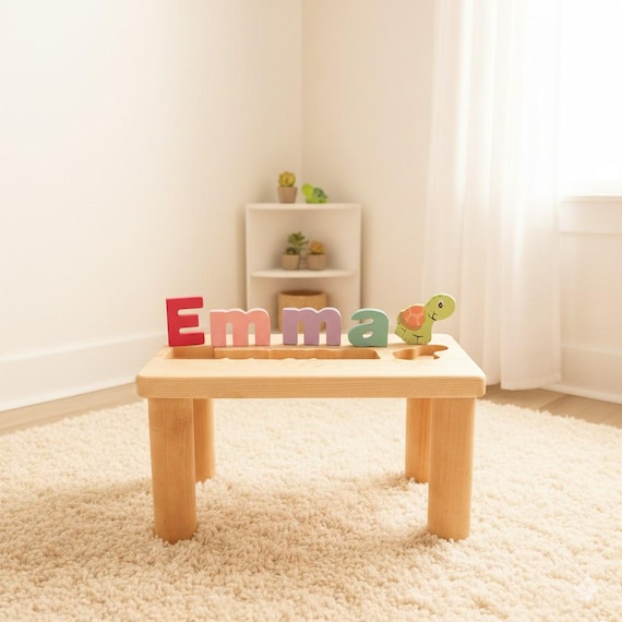A full-sized wooden bench where the legs spell out a child's name in puzzle pieces they can pull out and play with — furniture and toy in one brilliant object.