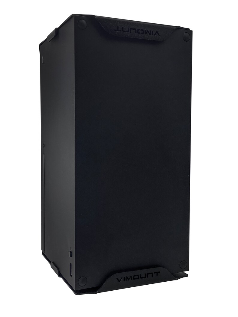 May include: A black metal stand with the word "VIMOUNT" printed on the front and back. The stand is designed to hold a computer tower.