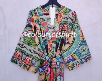 May include: A colorful, patterned kimono robe with a V-neck and long sleeves. The robe has a variety of colors and patterns, including pink, blue, green, yellow, and red. The robe is tied at the waist with a matching belt.