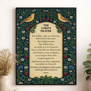 May include: A rectangular wall art print featuring The Lord's Prayer in black text on a cream background. The central text is framed by a dark blue border decorated with green vines, white flowers, and red strawberries, with two yellow birds.