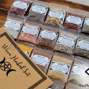 May include: A set of 16 small clear plastic bags filled with various dried herbs and spices. Each bag has a white label with the name of the herb or spice and its uses in Wiccan practices. The bags are arranged in a grid pattern on a wooden surface. The text on the label reads "Wicca Herbal Set" and "Blessings!"
