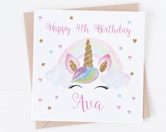 May include: A white card with a pink and gold unicorn with a rainbow behind it. The card says "Happy 4th Birthday Ava".