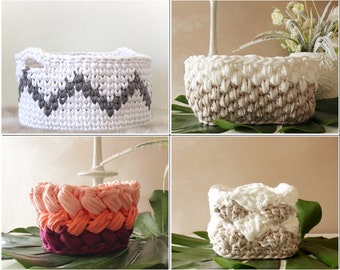 May include: Four crocheted baskets in different colors and patterns. The baskets are made with thick yarn and have a variety of textures. The baskets are perfect for storing items around the home.