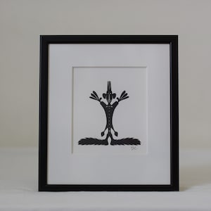 Frammed paper cut being. Made by danish paper cut artist Torben Jarlstrøm Clausen