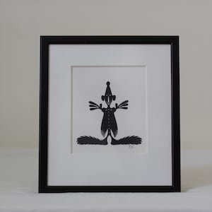 Frammed paper cut being. Made by danish paper cut artist Torben Jarlstrøm Clausen