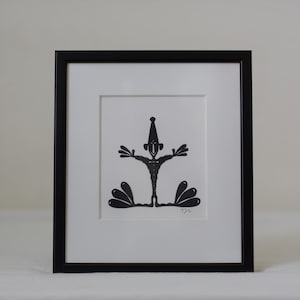 Frammed paper cut being. Made by danish paper cut artist Torben Jarlstrøm Clausen
