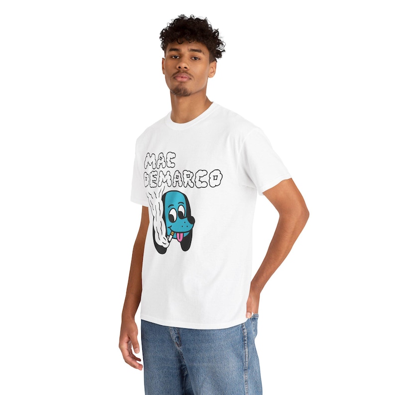 May include: White t-shirt with a blue cartoon dog smoking a cigarette and the text "MAC DEMARCO" printed on the front.