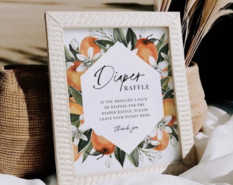 May include: A white framed sign with a floral design featuring oranges and white flowers. The sign says "Diaper Raffle" and includes instructions for guests to leave their raffle ticket if they brought diapers.