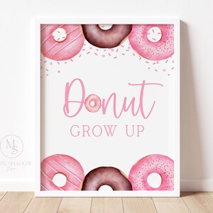 May include: Pink and brown donut-shaped illustrations with pink sprinkles and the text "Donut Grow Up" on a white background.