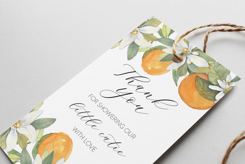 May include: White thank you tag with orange blossoms and oranges. The text reads "Thank you for showering our little cutie with love."