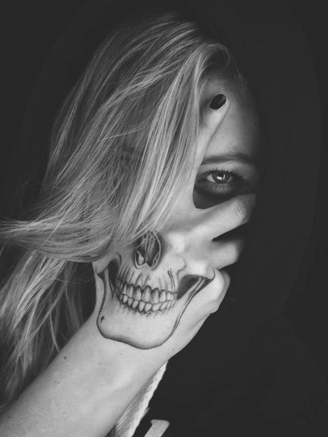 Skull Face Tattoo On Hand