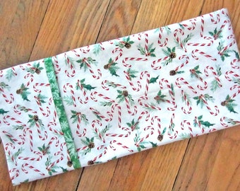 All cotton standard-queen pillowcases w/ tossed candy canes and greenery holiday fabric