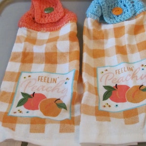 These are homemade crocheted kitchen towels peaches/ feeling peachy