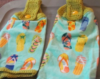 2 plush crocheted top kitchen towels summer flip flops on blue