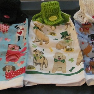 These are 3 hand crocheted top kitchen towels  dogs, Valentine Day. St. Pactrick, 4th of July,