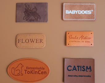 Etichette in pelle PU con logo personalizzato da 100 pezzi, etichette per abbigliamento personalizzate