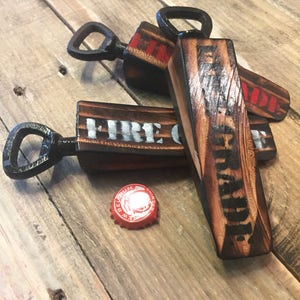 Firemans door chock bottle opener made from a genuine wooden firemans chock