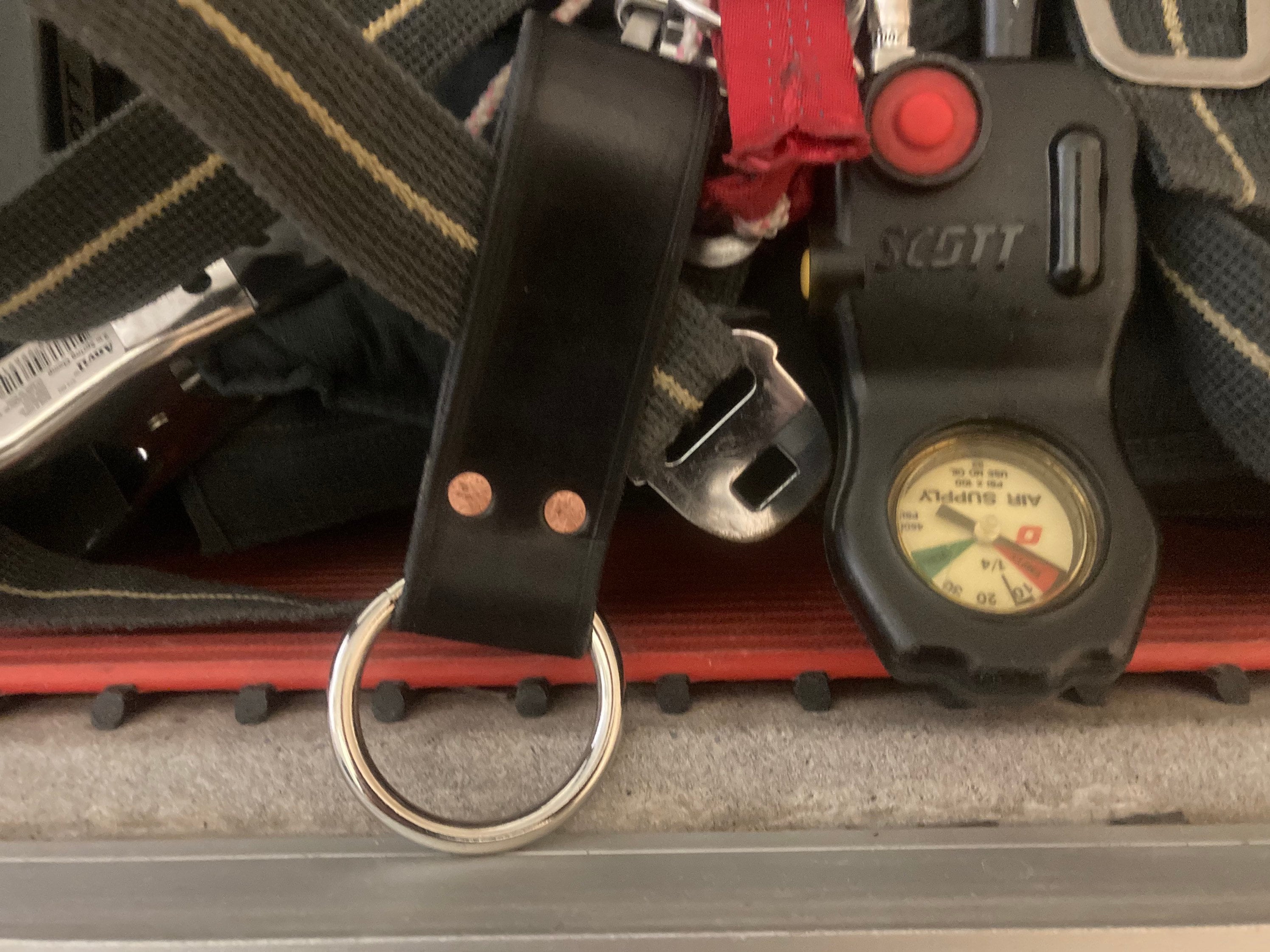 Firefighter tool ring glove ring to hang tools and glove straps from