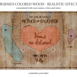 A personalized 16x20'' canvas stating 'The love between a MOTHER & DAUGHTER knows no distance', on a burnt wood-effect background, customizable with names, cities, states, and a date