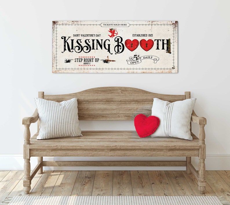 A playful 48x20'' 'Kissing Booth' canvas sign, with vintage typography and heart motifs, evoking a nostalgic Valentine's Day theme