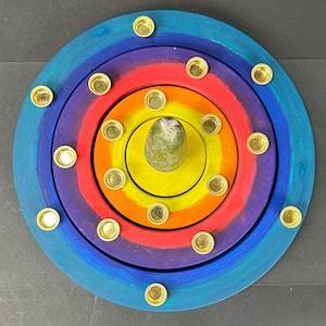 B- Candle holders in the wooden rings