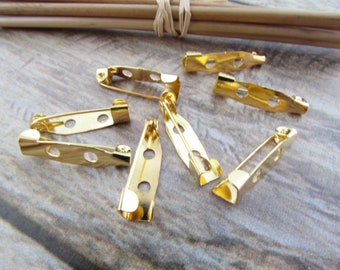 Badges, pin holder, badges color gilt metal, silver, bronze - 2 cm - 65